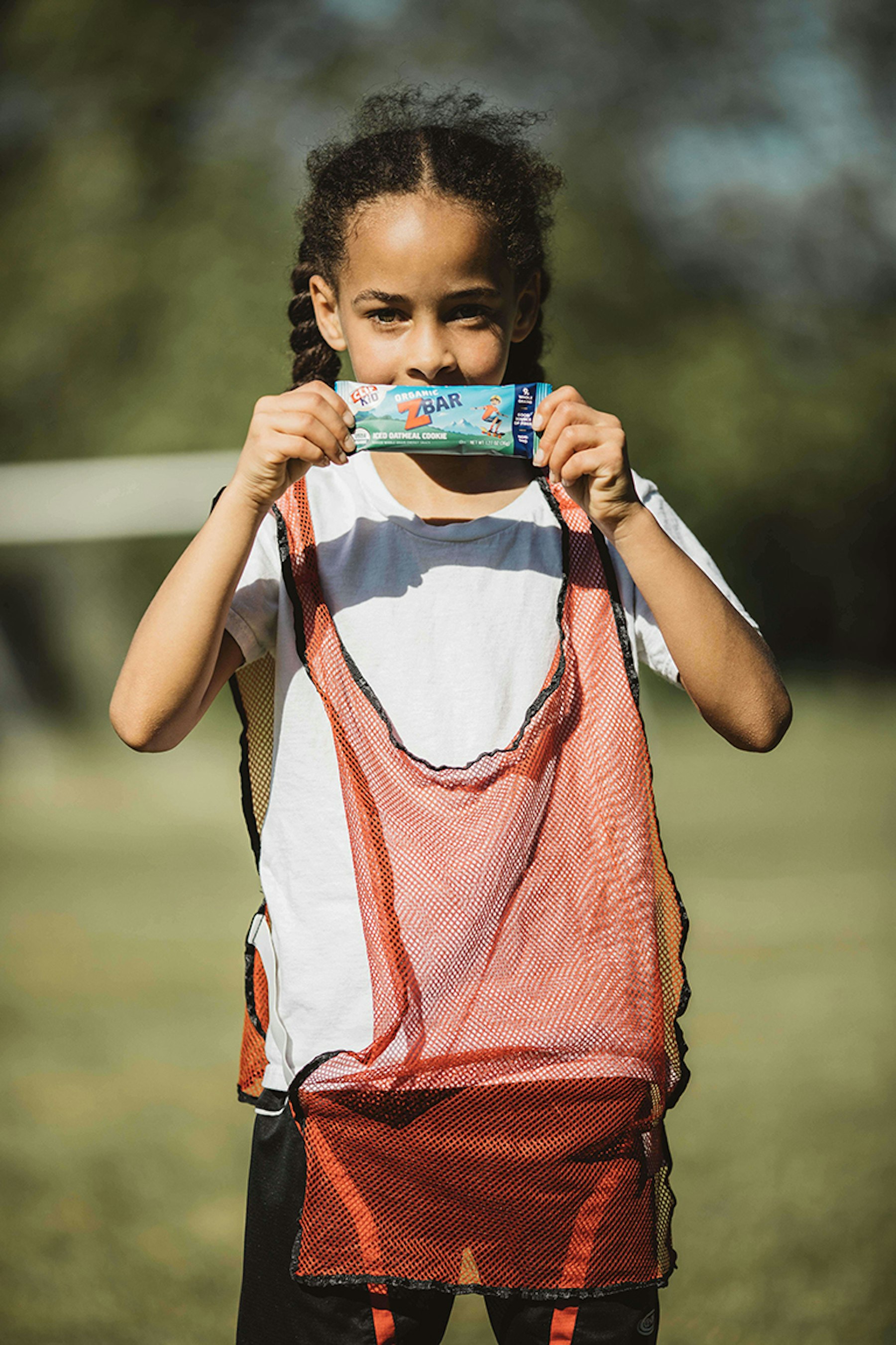 Soccer girl holding zbar