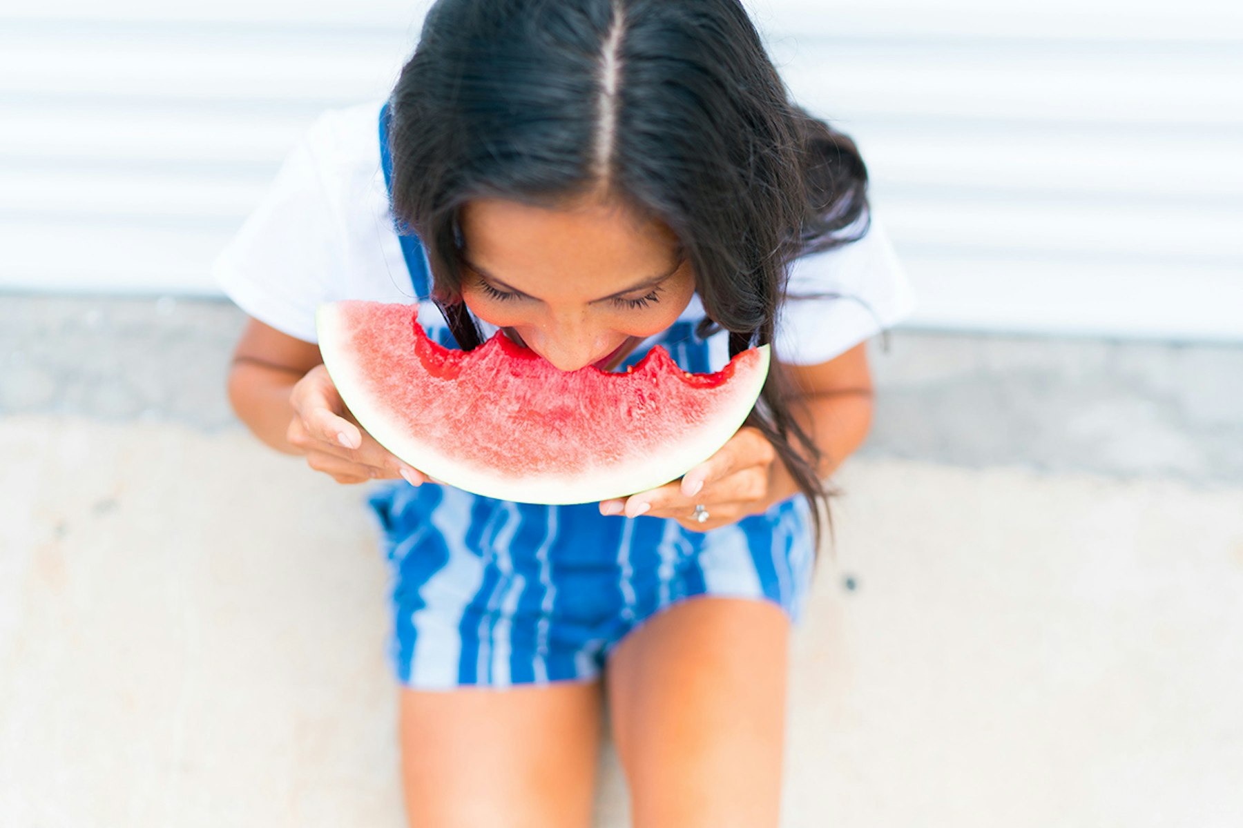 Woman eating watermelon slice